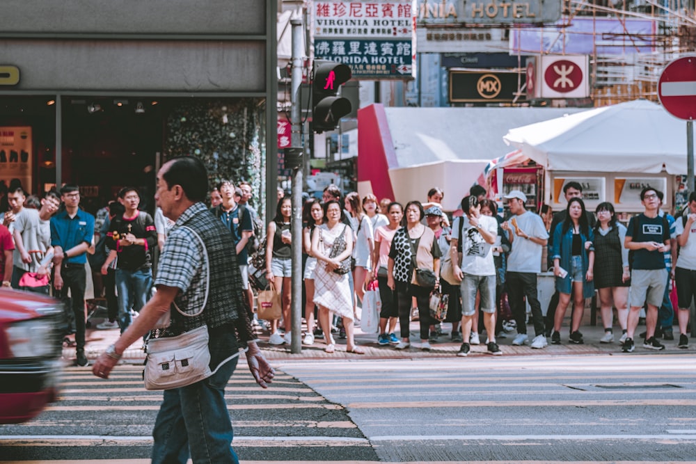 people waiting for pedestrian crossing