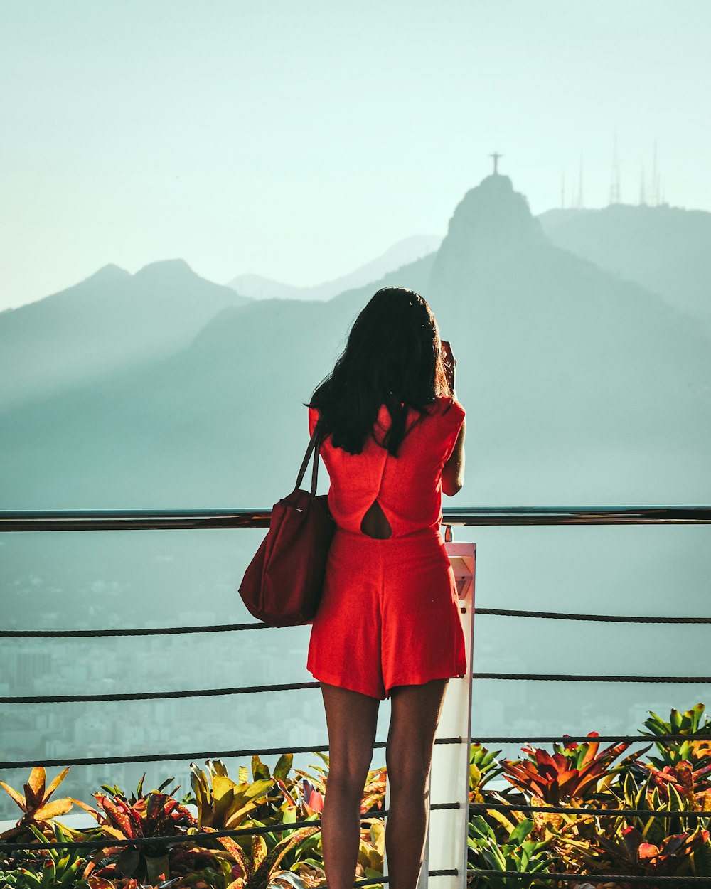 woman looking to the mountain during daytime