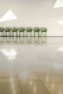 Freshly cleaned office chairs lined up in a bright workspace, highlighting restored fabric and freshness.