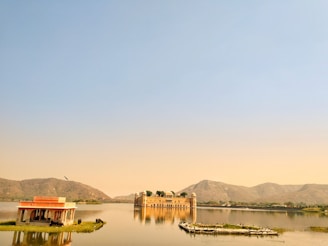 A serene lake view of the City Palace in Udaipur.