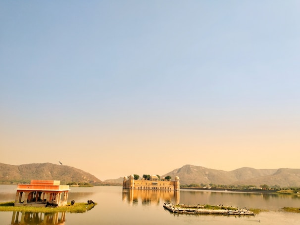 A serene lake view of the City Palace in Udaipur.