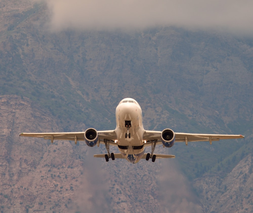 white airliner on flight during daytime