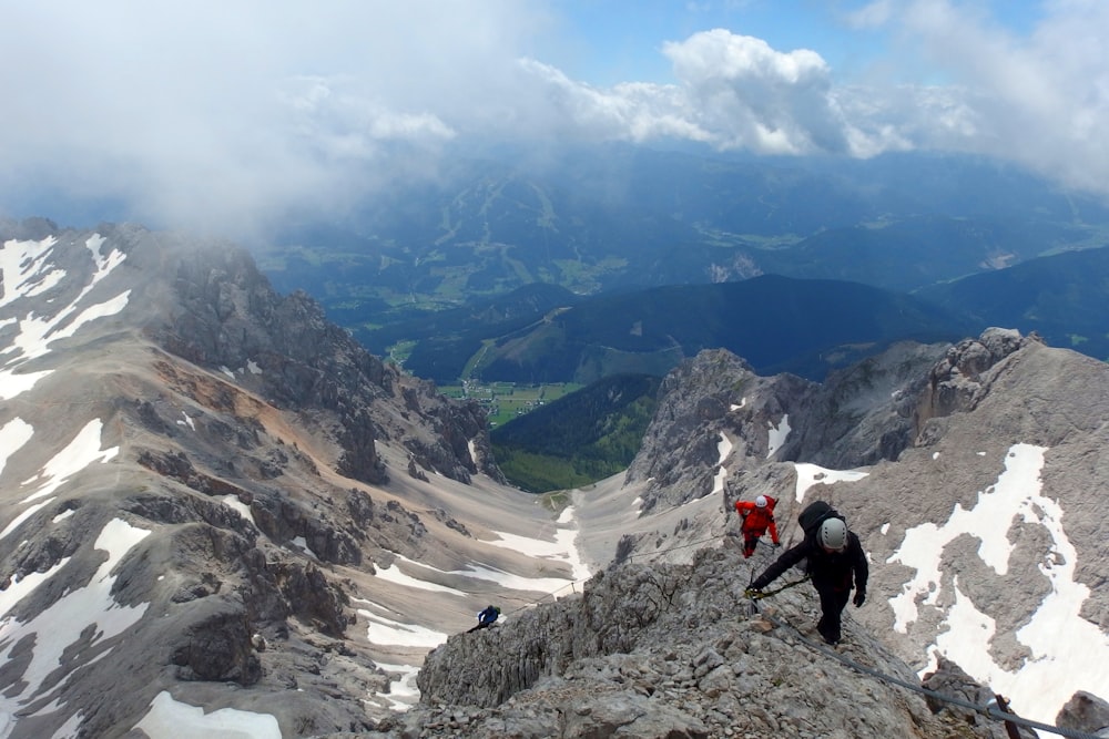 two person doing mountain hiking