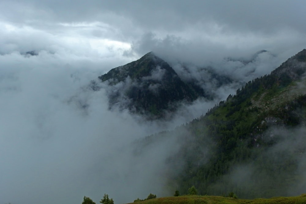 mountains covered with clouds during daytime