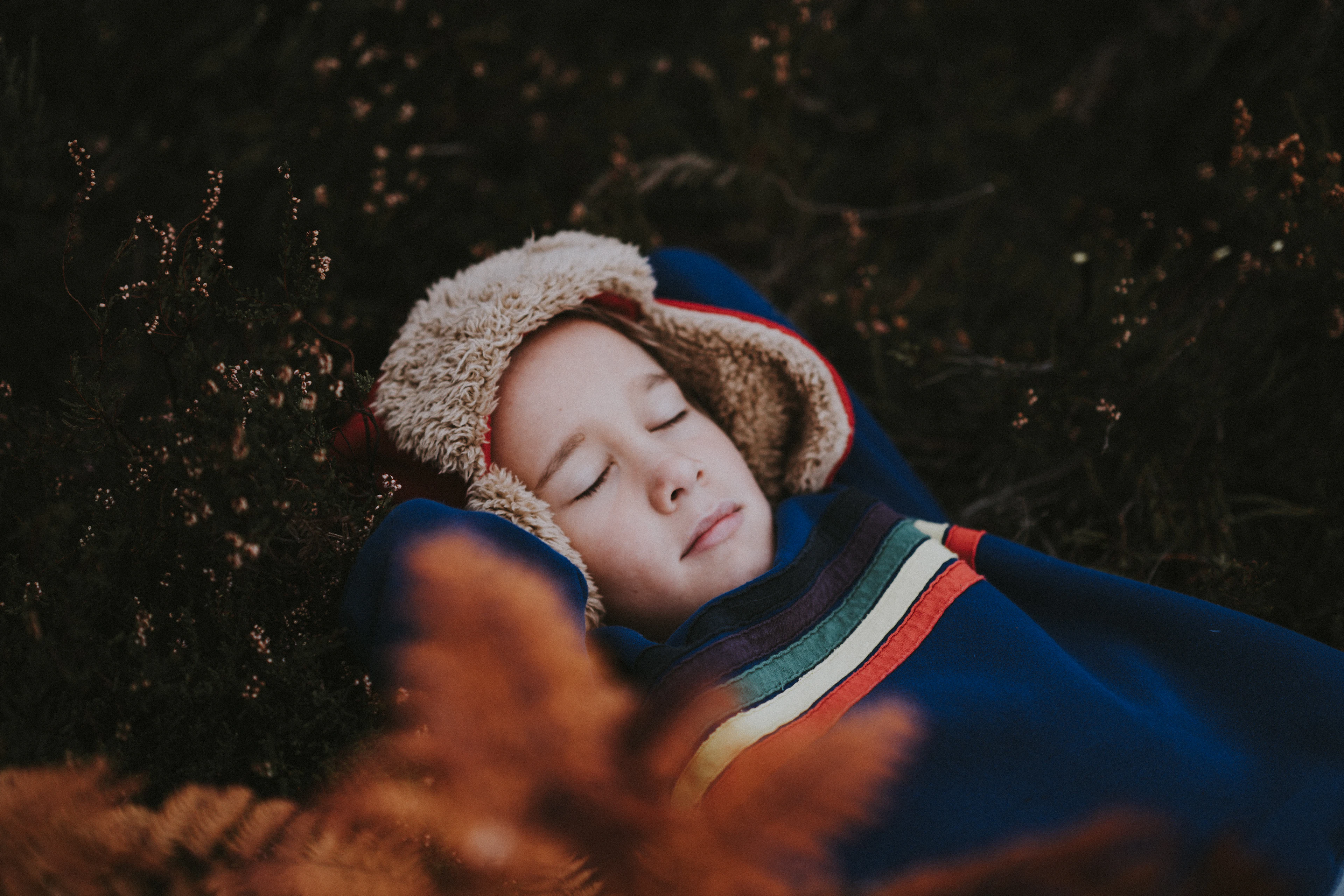 A child asleep in a warm sleeping bag