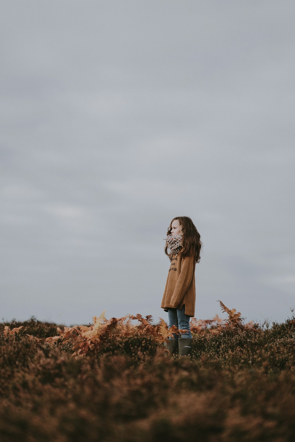 woman standing on hill