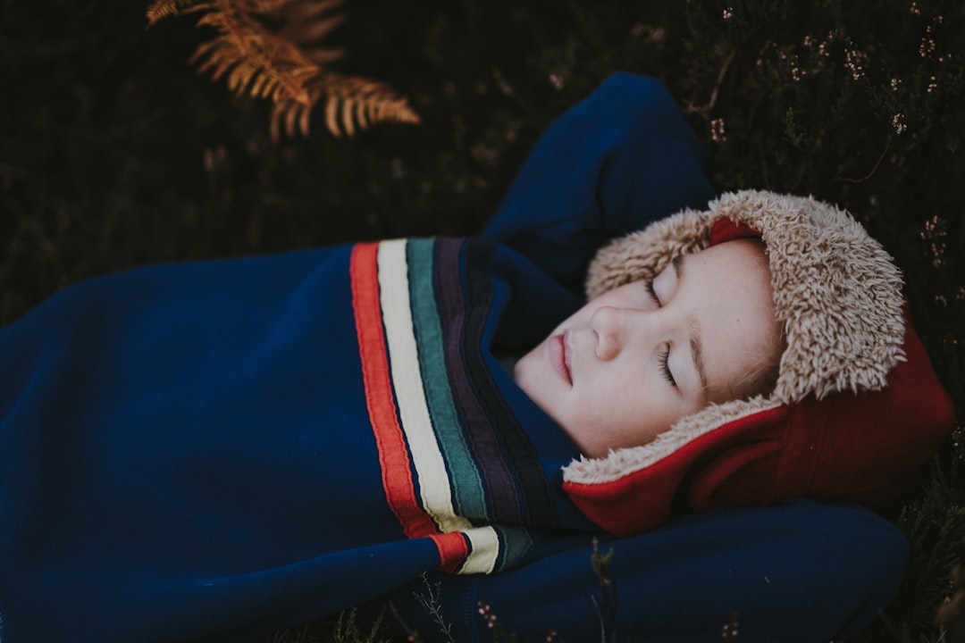 person wearing coat sleeping