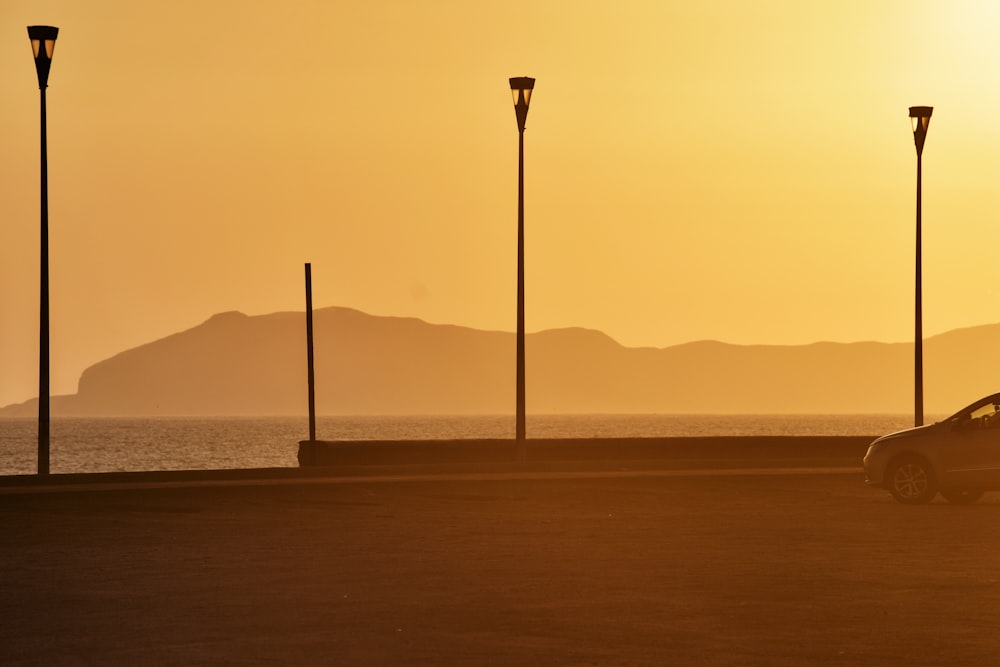 silhouette of electric posts