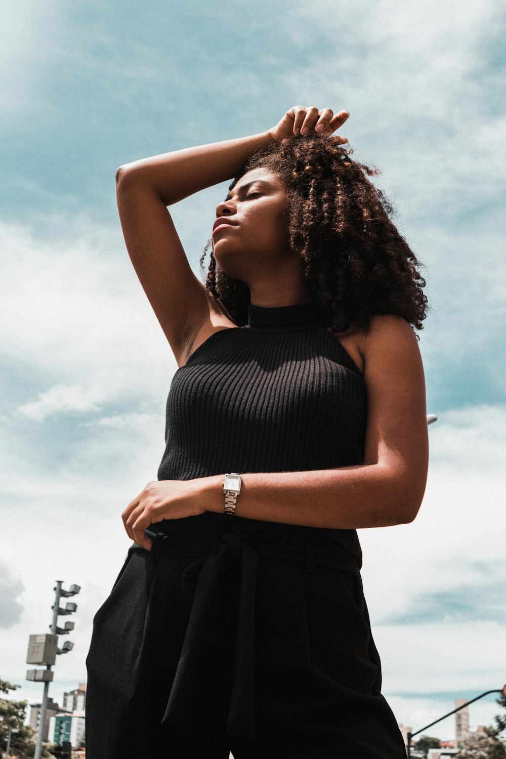 woman wearing black halterneck dress