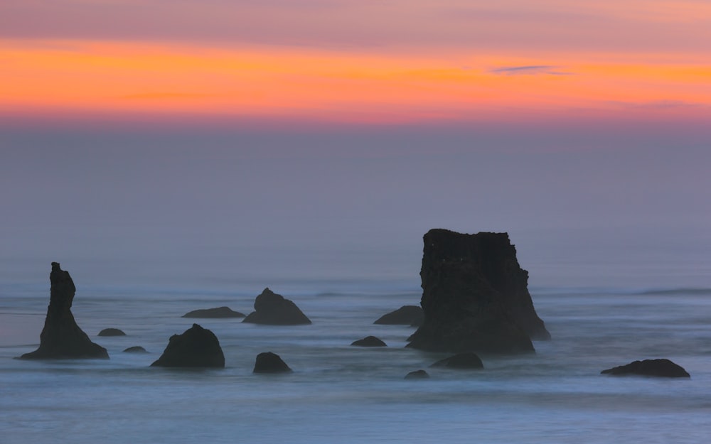 rock formation on body of water