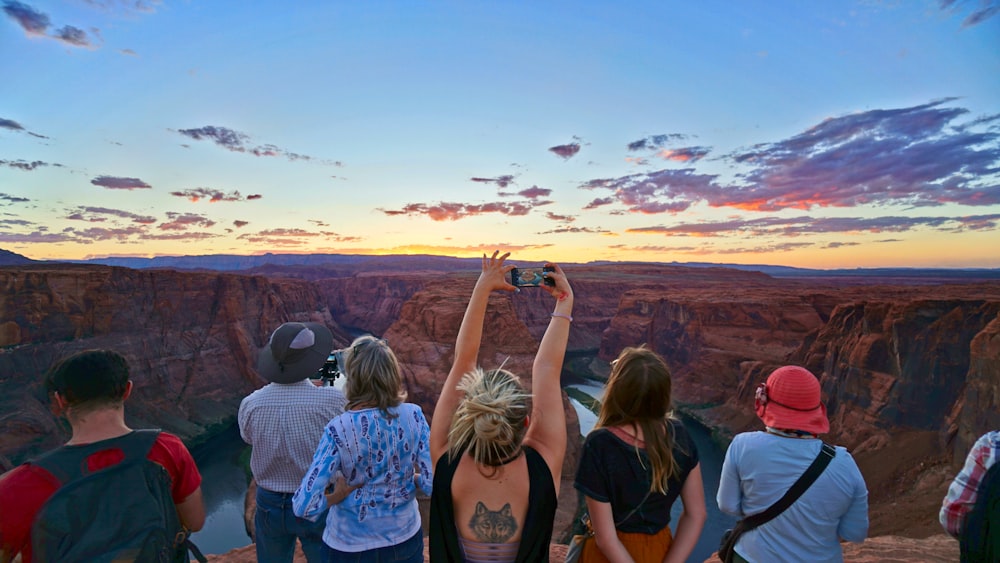 woman taking picture of Horseshoe Bend Arizona