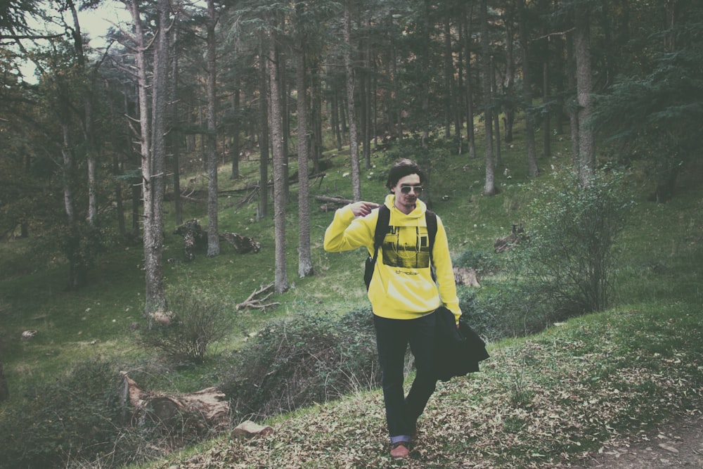 man wearing yellow pullover hooded jacket