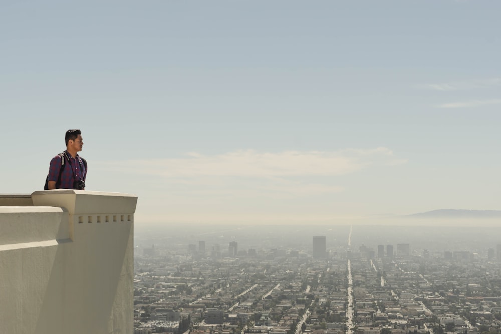 man standing at roof top