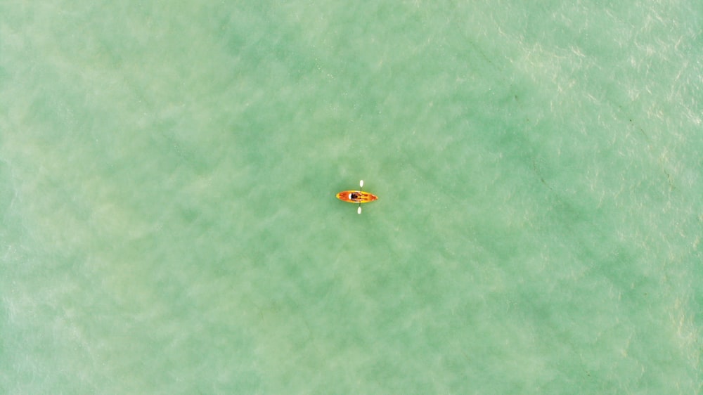 aerial view of boat on body of water