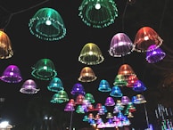 A cluster of colorful hanging lights adding a playful touch to a dining area.