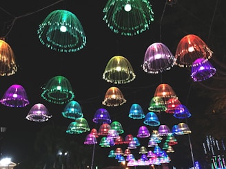 A cluster of colorful hanging lights adding a playful touch to a dining area.