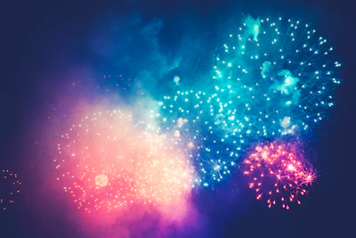 Colorful fireworks lighting up the sky at the end of a concert night.