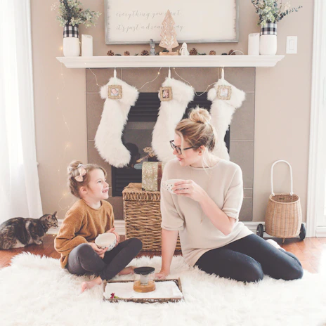 A cozy living room scene showing a caregiver helping a client with daily tasks.