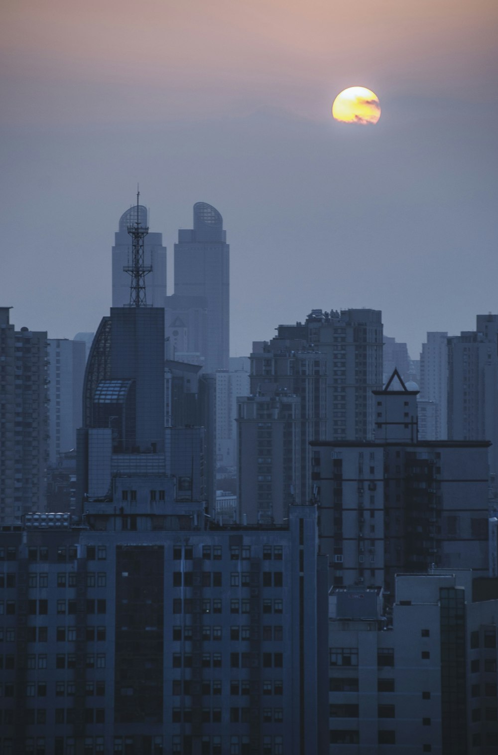 silhouette photo of buildings during golden hour