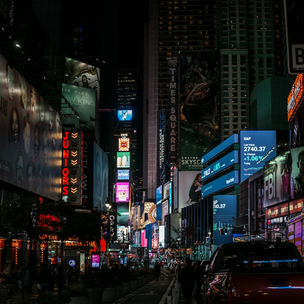 low angle photo of lighted buildings