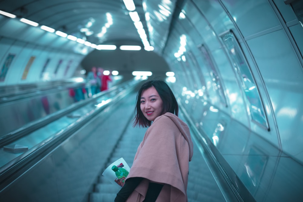 woman on escalator