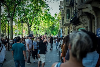 A scenic guided tour group exploring a vibrant city street filled with culture.