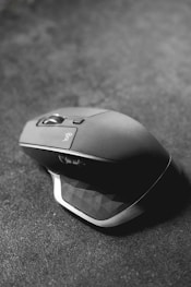 grayscale photography of Logitech gaming mouse