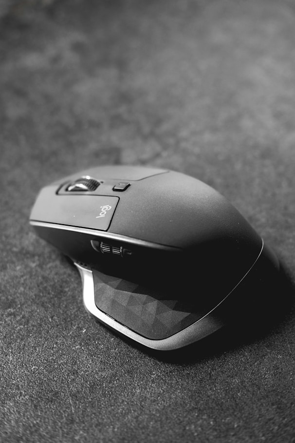 grayscale photography of Logitech gaming mouse