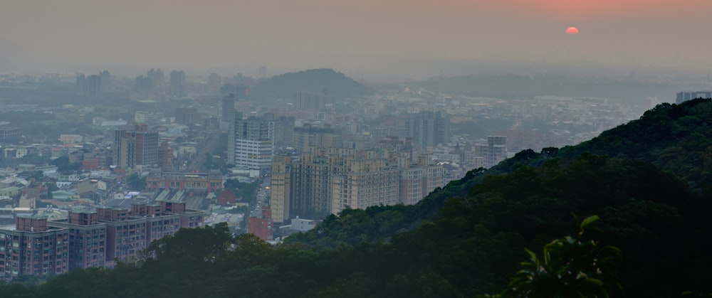 aerial photography of hill and city buildings at daytime