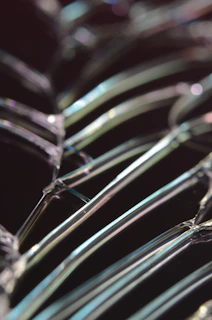 Close-up of tempered glass showing anisotropic stress patterns under polarized light