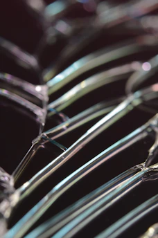 Close-up of tempered glass showing anisotropic stress patterns under polarized light