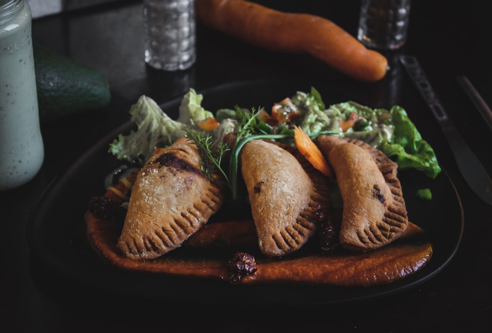 fried dumplings served on plate