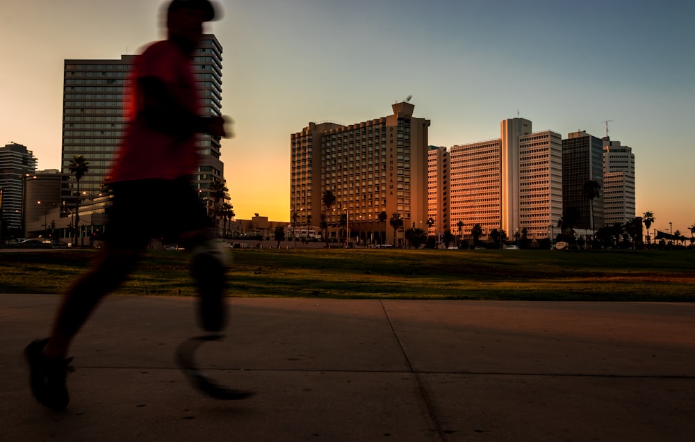 man running on pavement during daytime