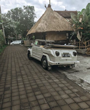 A stylish rental car parked in front of Divine Villa ready for island exploration.