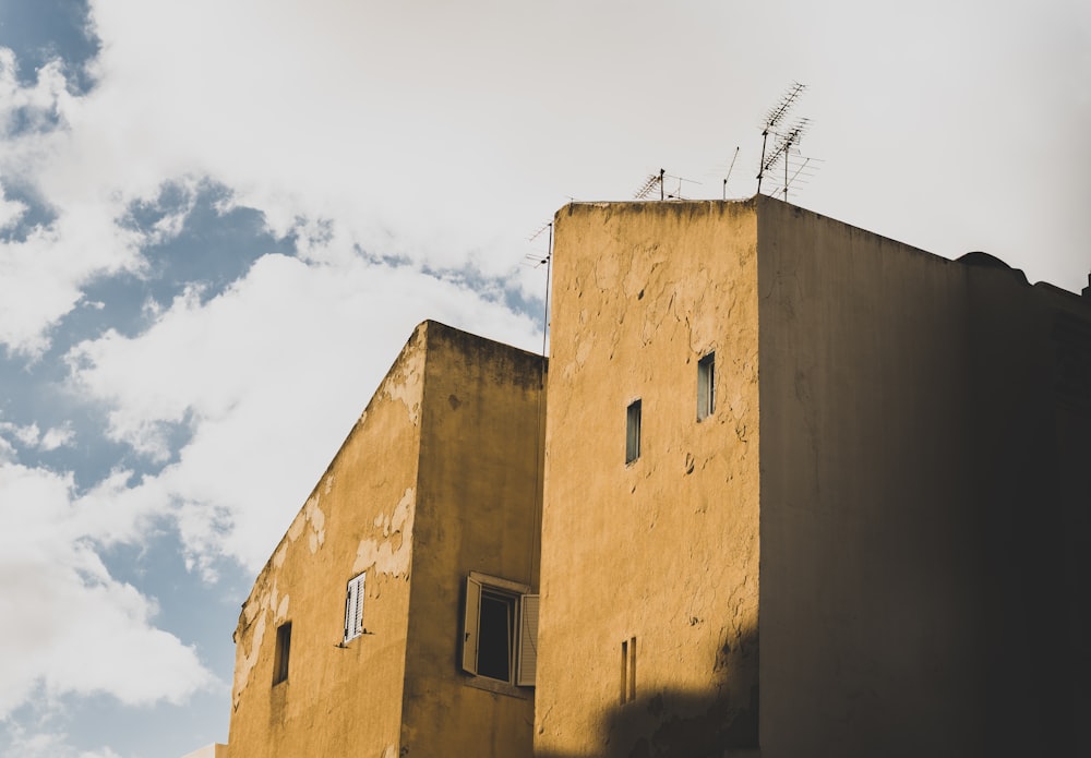 yellow concrete building during daytime