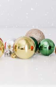 assorted-color baubles on white surface