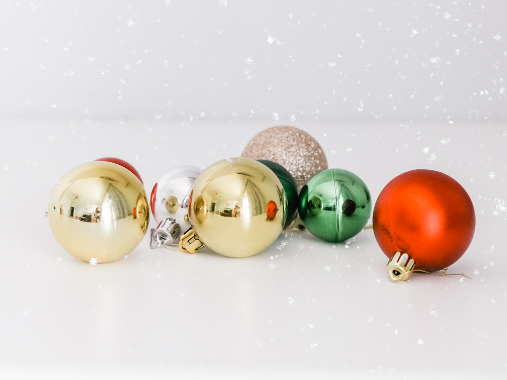 assorted-color baubles on white surface