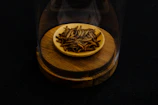 A set of delicate feeding tweezers and live insect containers arranged on a bright surface.