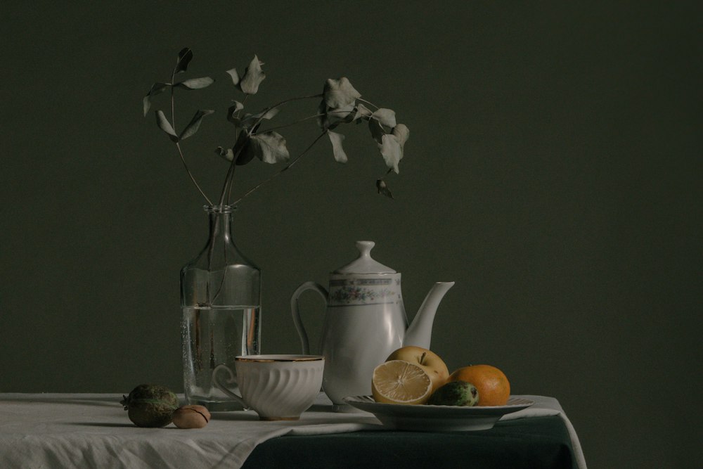 A quiet morning still life — teapot and dried flowers in warm light