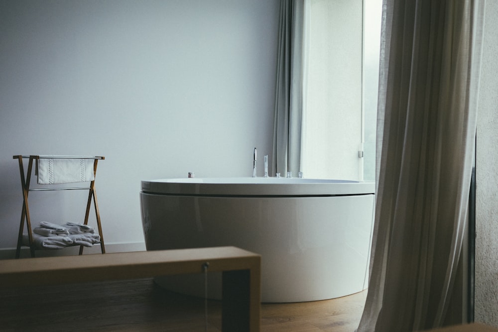 bathtub near the window