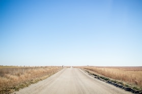 road under blue sky