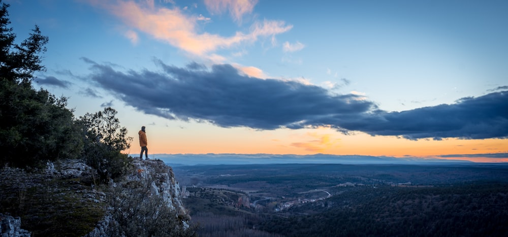 person standing on cliff