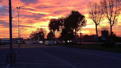 A beautiful sunset over a vacant lot.