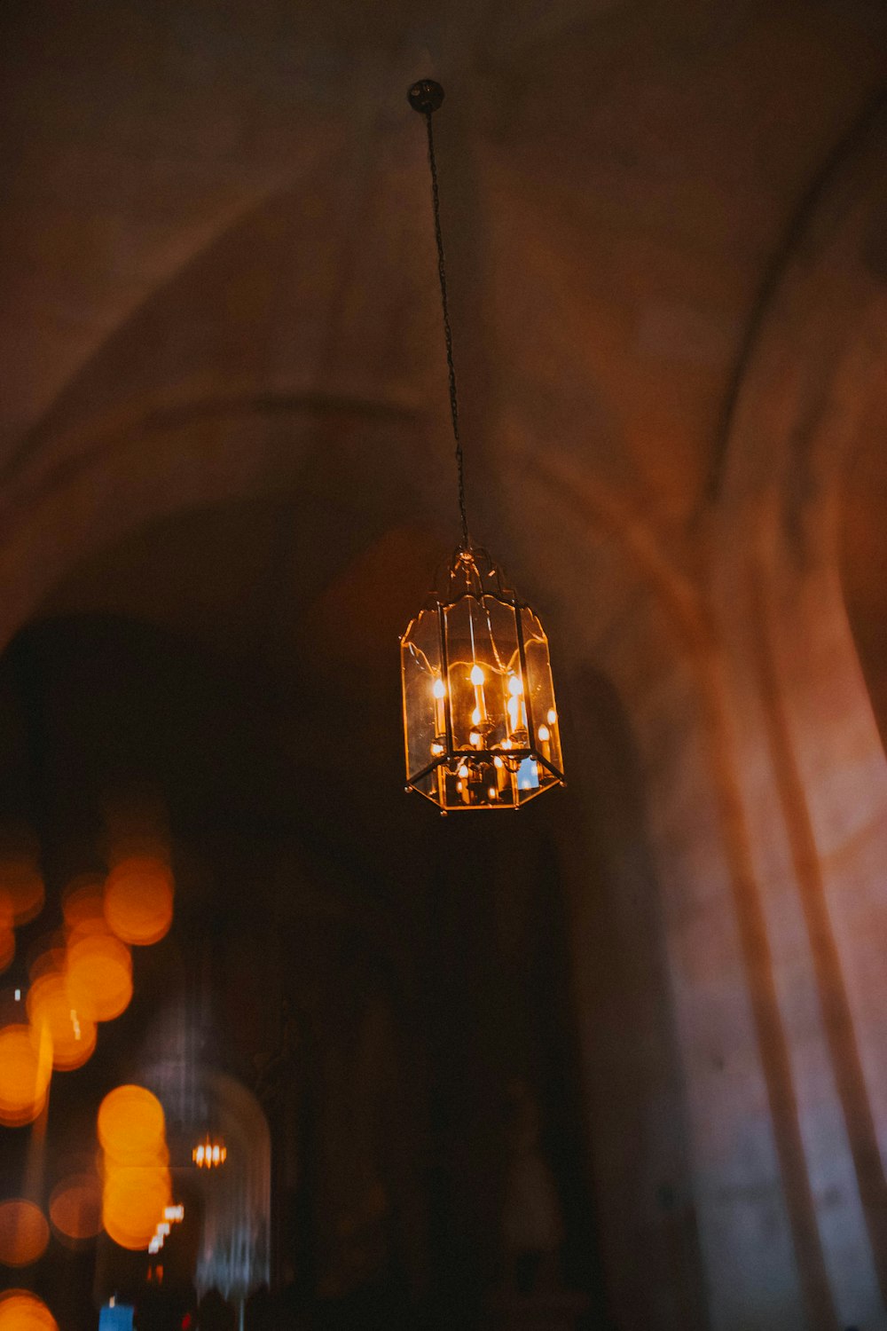 selective focus photography of pendant lamp