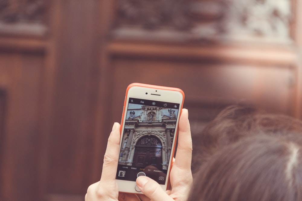 person holding gold iPhone 6