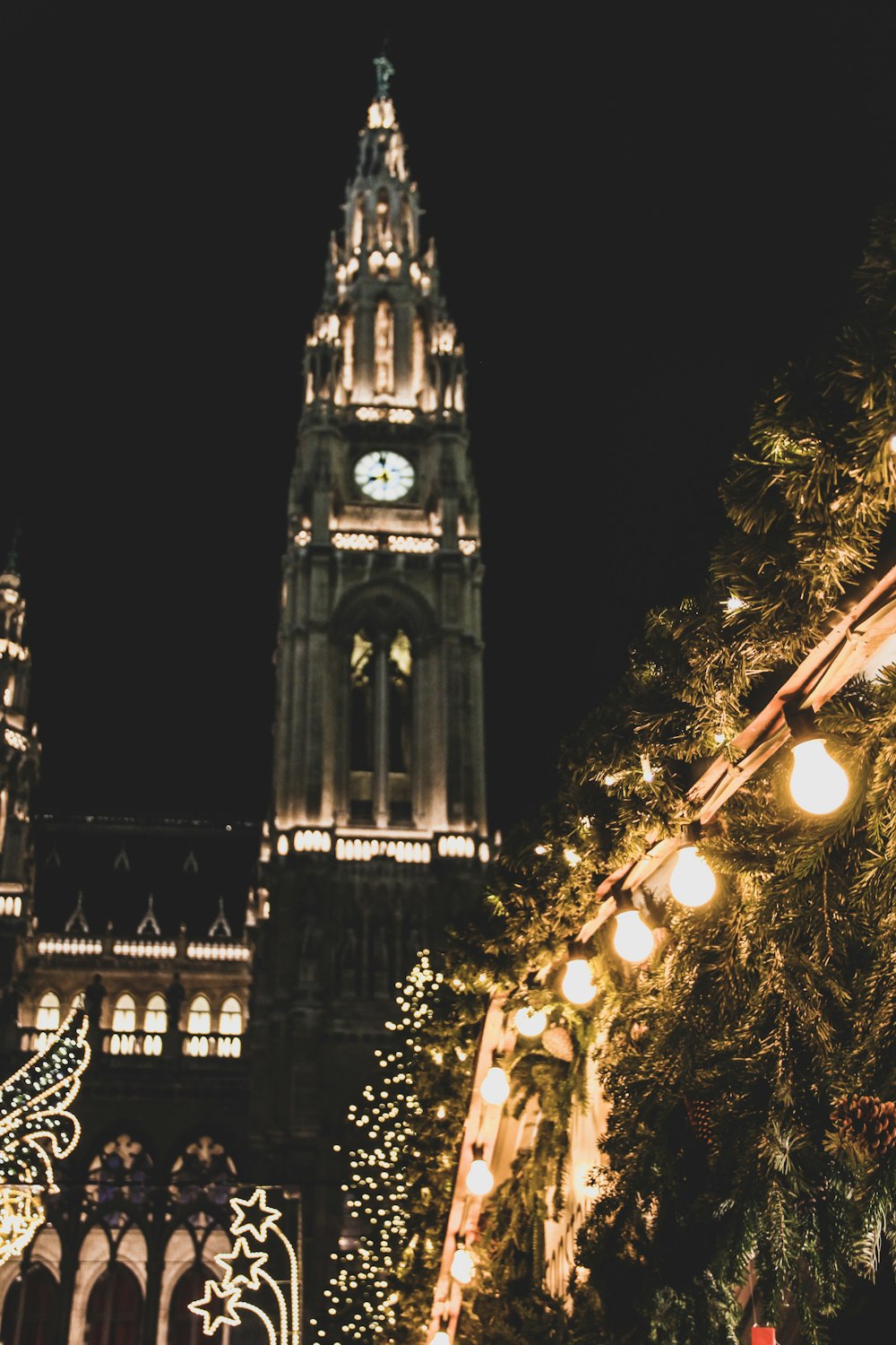 lighted clock tower at night