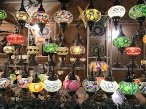 A collection of various lamp designs displayed together, showcasing the diversity and craftsmanship of the project.