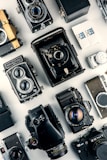 black cameras on white surface