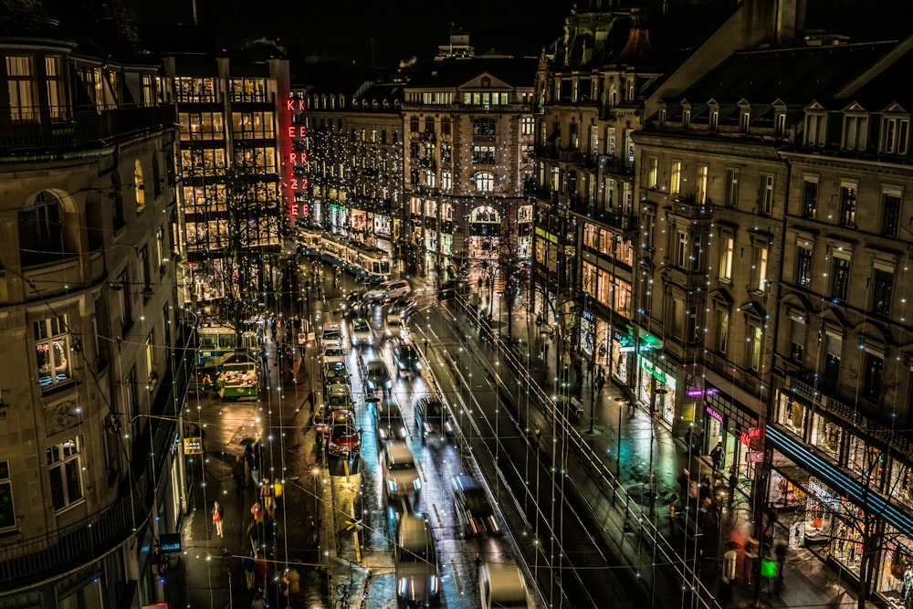 vehicles and people at the city during night \