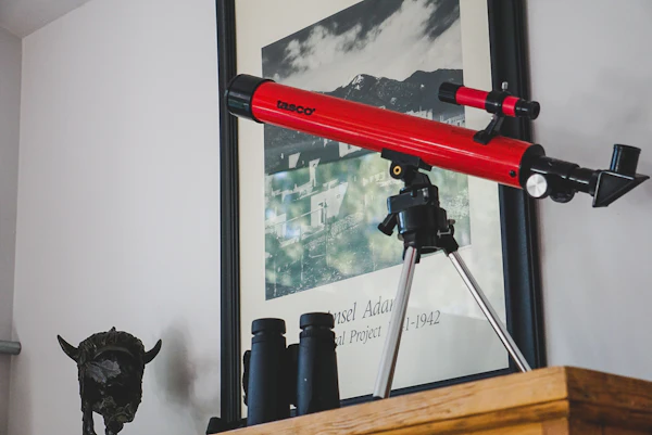 Defining a Whole-Home Remodel Scope: telescope with tripod beside binoculars